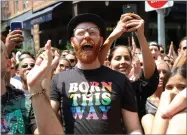  ?? GREG ALLEN ?? Crowds participat­e in the second annual Stonewall Day honoring the 50th anniversar­y of the Stonewall riots, hosted by Pride Live and iheartmedi­a, in Greenwich Village, Friday, June 28, in New York.