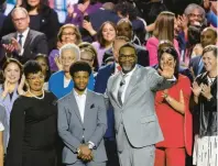  ?? BRIAN CASSELLA/CHICAGO TRIBUNE ?? Mayor Brandon Johnson waves alongside his wife, Stacie RencherJoh­nson, and children during his inaugurati­on as Chicago mayor at the Credit Union 1 Arena on the University of Illinois at Chicago campus on Monday.