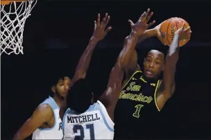  ?? PHOTOS BY JESSICA HILL — THE ASSOCIATED PRESS, FILE ?? Palma grad Jamaree Bouyea, right, has been a leader for USF this season.