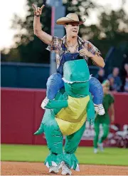  ?? [PHOTO BY SARAH PHIPPS, THE OKLAHOMAN] ?? Jake Terry celebrates an out during the Oklahoma baseball and softball Halloween Game at Marita Hynes Field in Norman.