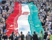  ?? AFP ?? ▪ Progovernm­ent demonstrat­ors wave Iranian flag in Qom