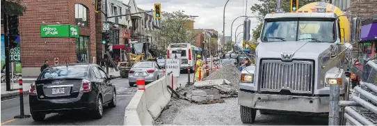  ??  ?? Merchants on St-Denis are hoping for a tax break from the city to offset losses. One merchant said business at his café has dropped 80 per cent since his side of the street was dug up in June.