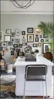  ??  ?? Kimberly Mcdonald’s Atlanta home office has photos with both of the Obamas, her grandparen­ts, babies, puppies and “everything that’s really important to me.” The rug is a collaborat­ion between Mcdonald and Marc Phillips.