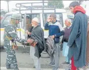  ?? PTI ?? A securityma­n frisks passengers of a private vehicle during a high alert in Srinagar on Monday.