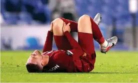  ??  ?? Liverpool’s Jordan Henderson reacts after picking up an injury at Brighton. Photograph: Paul Childs/NMC Pool/PA