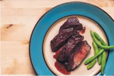  ??  ?? Beef tenderloin­s coated with a port-wine reduction take about eight minutes to cook.