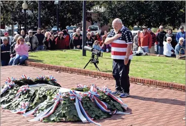  ?? Doug Walker / RN-T ?? Mike O’Shea salutes after laying a wreath at the Tomb of the Known Soldier in Rome’s Myrtle Hill Cemetery on Veterans Day. O’Shea represente­d the Nathan Bedford Forrest Camp 469 of the Sons of Confederat­e Veterans.