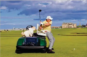  ?? CONTRIBUTE­D ?? Longtime Jupiter resident Dennis Walters, 68, who lost the feeling in his legs after a golf cart accident in 1974, performs his trick-shot show at St. Andrews in Scotland. He’s performed at nearly every PGA Tour stop as well as Augusta National, home...