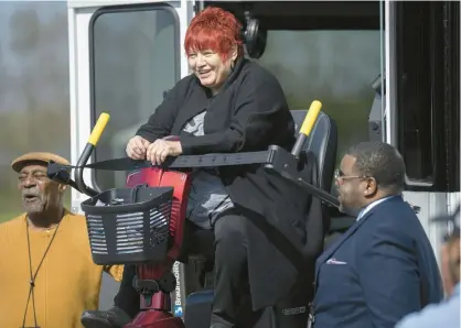  ?? KYLE TELECHAN/POST-TRIBUNE ?? Teresa Torres, executive director of Everybody Counts Inc, tests out the wheelchair loading ramp on a new Gary Public Transporta­tion Corp. Access219 vehicle on Wednesday.