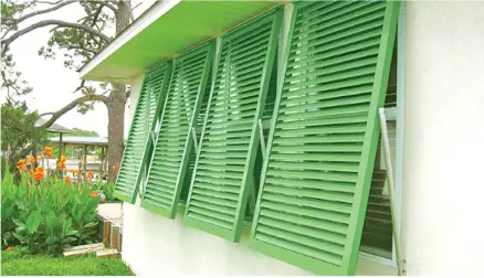  ??  ?? Bahama shutters simultaneo­usly deliver important storm protection.
