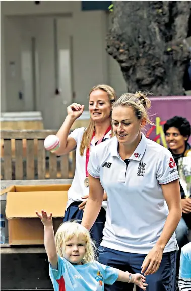  ??  ?? Lord’s and ladies: The triumphant England squad demonstrat­e skills at the Home of Cricket yesterday