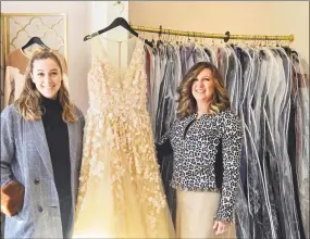  ?? Kelly Goddard / Contribute­d photo ?? Lyndsay Rinere,left, and Christine Rinere with a prom dress in The Dressing Room.