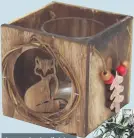  ??  ?? Log cube tealight holder with fox &amp; bells, £6, visit giselagrah­am.co.uk for stockists