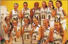  ??  ?? The Mid-Atlantic Magic 6th-grade girls AAU basketball team put on a dominating performanc­e in the Middle Atlantic District Championsh­ip.