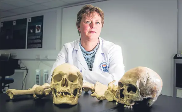  ??  ?? Dr Lucina Hackman with some of the bones used for education at the College of Life Sciences, University of Dundee.