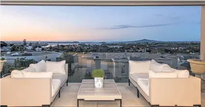  ??  ?? This Remuera Rd apartment with floor-to-ceiling windows has views across to Rangitoto.