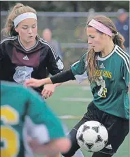  ?? GUARDIAN PHOTO BY JASON MALLOY ?? Colonel Gray’s Emma Moore, left, and Three Oaks’ Savanah Arsenault battle for the ball during Prince Edward Island School Athletic Associatio­n senior girls AAA soccer semifinal action Wednesday in Cornwall.