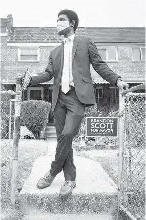  ?? ULYSSES MUÑOZ/BALTIMORE SUN ?? City Council President Brandon Scott accepts the Democratic nomination for mayor of Baltimore on June 10 at his grandparen­ts’ house near where he grew up in Park Heights.