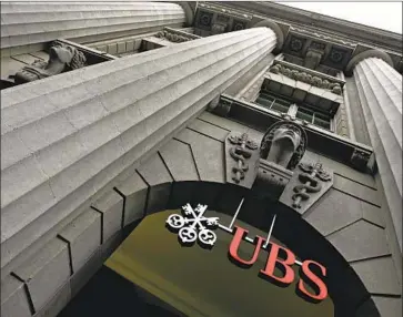  ?? Walter Bieri Associated Press ?? SWISS BANKS like UBS will soon start charging larger depositors to hold their cash, a move the Swiss pioneered back in the 1970s to keep their currency from appreciati­ng too much after the gold standard ended.