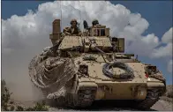  ?? U.S. Army photo by Cpl. Alisha Grezlik ?? ■ Montana National Guard goes on maneuvers in the Bradley A4 Infantry Fighting Vehicle at the National Training Center, Fort Irwin, California. Red River Army Depot will play a major part in the coming Bradley upgrade program.