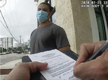  ?? Miami Beach Code Compliance ?? A man is fined in Miami Beach for allegedly violating the city’s mask rule on July 23.