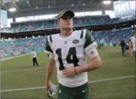  ?? LYNNE SLADKY - THE ASSOCIATED PRESS ?? FILE - In this Sunday, Nov. 4, 2018, file photo, New York Jets quarterbac­k Sam Darnold (14) walks off the field after an NFL football game in Miami Gardens, Fla. Darnold has a boot on his right foot and is not practicing, leaving his status for the team’s game against Buffalo on Sunday in doubt. Darnold was injured during the Jets’ 13-6loss at Miami last Sunday, but finished the game.