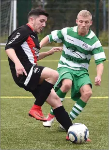  ??  ?? Newfoundwe­ll’s Colm Neary closes down Miceli Corsi of Drogheda Town during their Premier Reserve game.