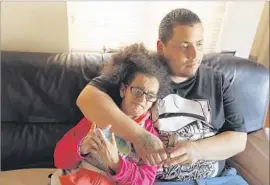  ?? Genaro Molina Los Angeles Times ?? JESUS ARREOLA ROBLES cares for his sister Maria Lupita Arreola, who suffers from progeria. He was arrested by Border Patrol and accused of smuggling.