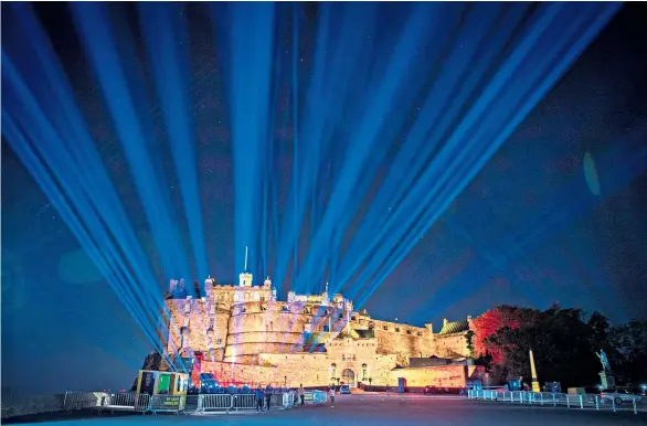  ??  ?? The shining Shafts of light soar into the sky above Edinburgh Castle, projected from behind the castle walls, in My Light Shines On, a city-wide event marking what would have been the start of the Edinburgh Festival.