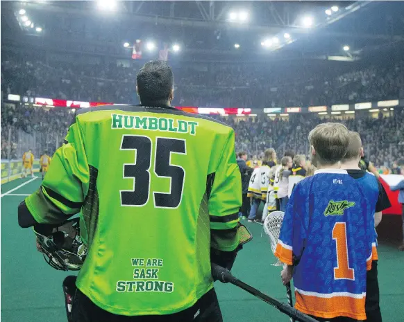  ?? DAVID STOBBE ?? Players from the Saskatchew­an Rush and Georgia Swarm had “Humboldt” and “Broncos” on the backs of their jerseys for their NLL game at SaskTel Centre on Saturday. The game jerseys will be on auction until April 21, with the proceeds donated to the...