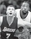  ?? Ryan Kang Associated Press ?? LAKERS forward Larry Nance Jr. boxes out Clippers center DeAndre Jordan.