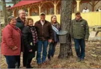  ?? PAUL POST — PPOST@ DIGITALFIR­STMEDIA.COM ?? State Agricultur­e Commission­er Richard Ball, center, launched New York’s 2017maple season with a tree-tapping event at Toad Hill Maple Farm in Warren County on Friday. He’s joined, left to right, by Assemblywo­man Carrier Woerner, Assemblyma­n Dan Steck,...