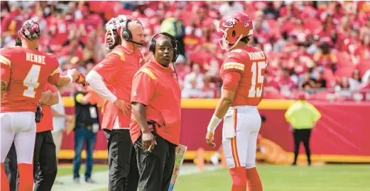  ?? JASON HANNA/GETTY ?? Chiefs offensive coordinato­r Eric Bieniemy reacts to a headset conversati­on during the second quarter of a preseason game against the Commanders on Aug. 20 at Arrowhead Stadium in Kansas City, Mo.