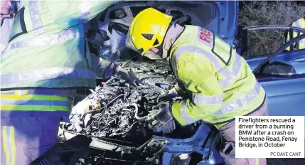  ?? PC DAvE CANT ?? Firefighte­rs rescued a driver from a burning BMW after a crash on Penistone Road, Fenay Bridge, in October
