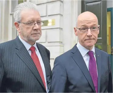  ?? Pictures: PA/Kris Miller. ?? Deputy First Minister John Swinney, right, and Brexit Minister Mike Russell in London for talks over Brexit with UK Government ministers in September. Right: Eastern European workers at a berry farm near Dundee. Many farms in Tayside and Fife are...