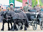  ?? ?? The Queen received the winners cup at the Royal Windsor Horse Show, top, where Lady Louise Windsor drove the late Duke of Edinburgh’s carriage, above