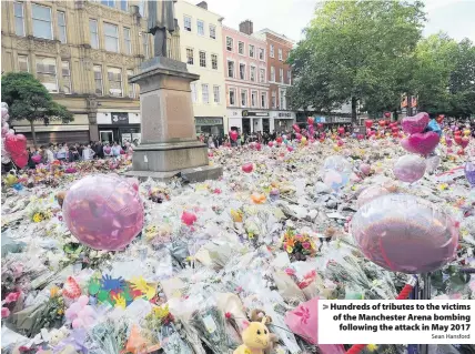  ?? Sean Hansford ?? > Hundreds of tributes to the victims of the Manchester Arena bombing following the attack in May 2017