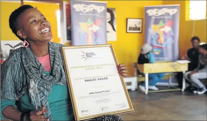  ?? PHOTO: ANTONIO MUCHAVE ?? SATISFACTI­ON: Social entreprene­ur Nthabiseng Letsoso savours the moment after winning the Soweto Business Stars award for her after school art project in Orlando West, Soweto