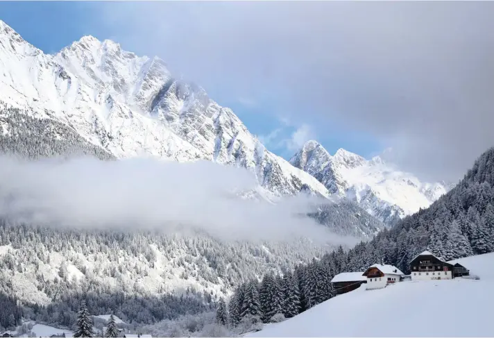  ??  ?? Clouds hang over the valley during cold winter weather in the German speaking Italian province of South Tyrol in Rasun-Anterselva, Italy, yesterday. Photo: AP