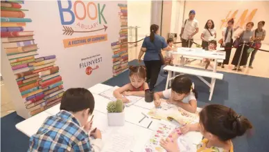  ??  ?? FILL THEIR WORLD WITH WORDS The month-long campaign of Bookabular­y aims to encourage kids to read more and instill good values formation