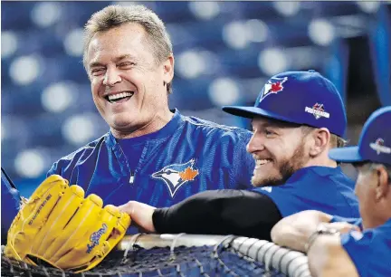  ?? NATHAN DENETTE/THE CANADIAN PRESS ?? Blue Jays manager John Gibbons, left, and third baseman Josh Donaldson in high spirits during an optional practice in Toronto on Tuesday ahead of Game 5 in the ALDS playoffs in the Rogers Centre on Wednesday.