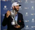  ?? FRANK FRANKLIN II — THE ASSOCIATED PRESS ?? Dustin Johnson poses with the trophy after winning the Travelers Championsh­ip golf tournament at TPC River Highlands, Sunday, June 28, 2020, in Cromwell, Conn.