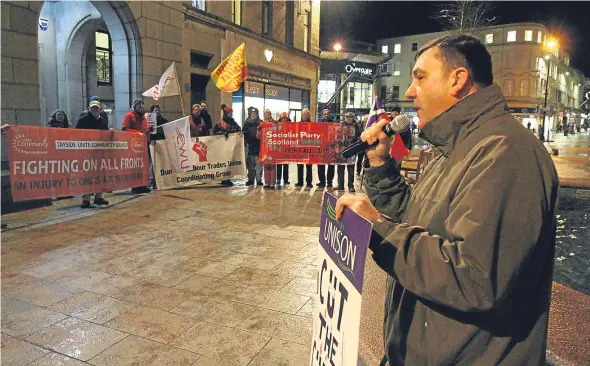  ??  ?? Jim McFarlane, Dundee’s Unison branch secretary, addresses protesters in City Square ahead of the budget meeting.