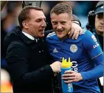 ??  ?? IN THE HUNT: Rodgers and striker Vardy aim to see Leicester challenge the top six