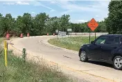  ?? AP Photo/Kelly P. Kissel ?? A motorist prepares to enter a constructi­on area Wednesday on Interstate 440 in North Little Rock, Ark. Arkansas' Highway Commission voted to pursue a highway funding plan that would require a vote from the public in 2018.