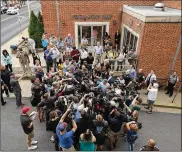  ?? CHIP SOMODEVILL­A / GETTY IMAGES ?? Journalist­s and protesters gather Monday outside a Charlottes­ville court where a bond hearing was held for James Alex Fields Jr., accused of driving his car into a crowd of people protesting a gathering of white supremacis­ts.