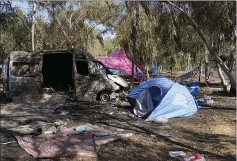  ?? AP PHOTO/OHAD ZWIGENBERG, FILE ?? The site of a music festival near the border with the Gaza Strip in southern Israel, Oct. 12, 2023.