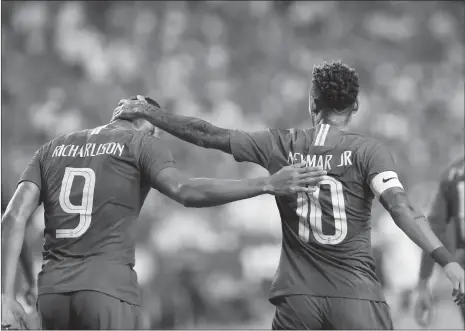  ?? Photo: IC ?? Brazil forward Richarliso­n celebrates with teammate Neymar after scoring during the first half of their friendly match against El Salvador at FedExField in Landover, Maryland on Tuesday.