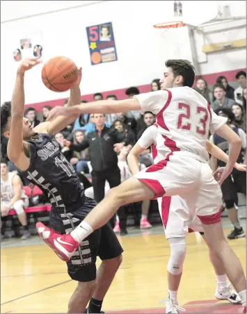  ?? Photo by Ernest A. Brown ?? Shea wing Kenny Silva attempts a shot in the first half of the Raiders’ 69-64 Division II victory over Cranston West Thursday. The victory ensured the Raiders won’t have to leave Pawtucket to reach the D-II semifinals.