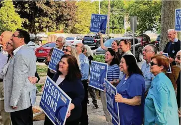  ?? Sarah Page Kyrcz/Hearst Connecticu­t Media ?? Supporters of the Re-elect Peggy Lyons for First Selectmen campaign gather outside Memorial Town Hall to hear Lyons announce her reelection bid.